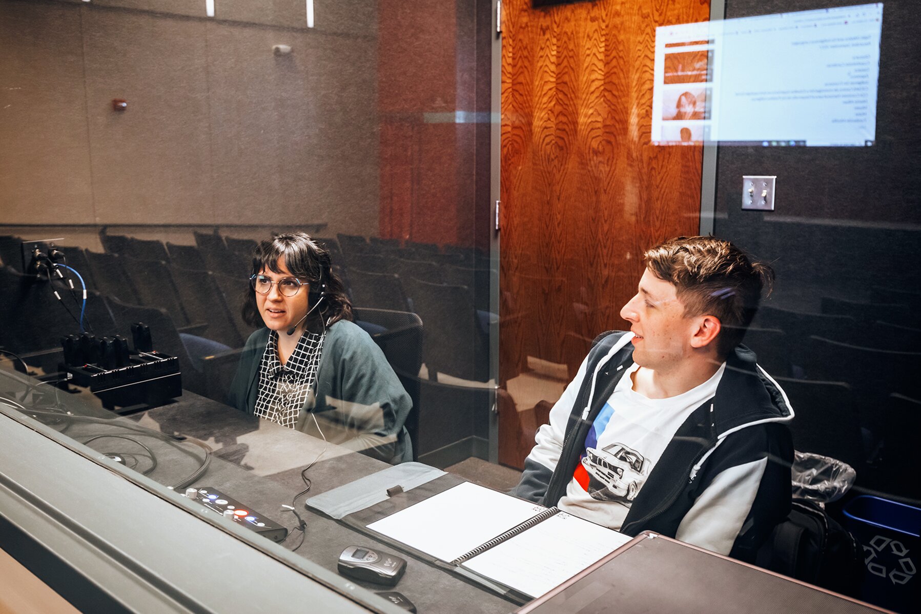 two students in a recording booth